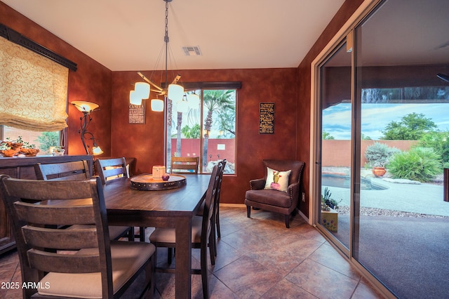 dining space featuring a chandelier