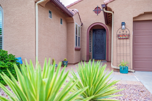 property entrance with a garage