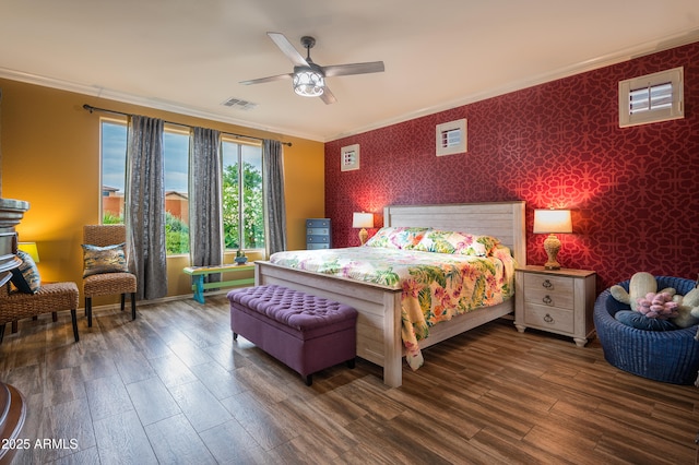 bedroom with crown molding, ceiling fan, and dark wood-type flooring