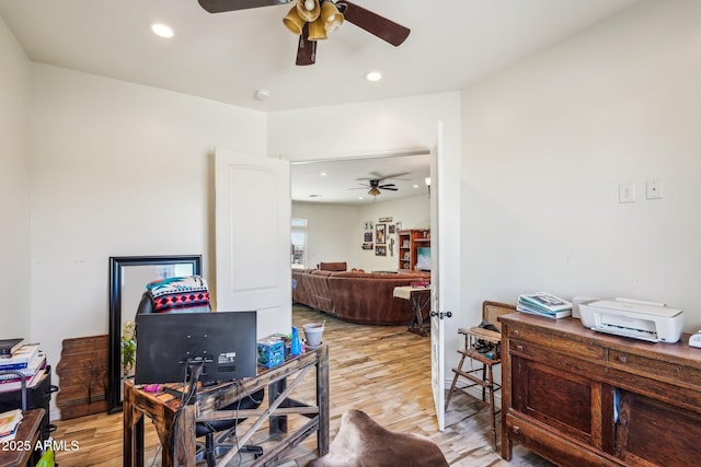 office area with ceiling fan and light hardwood / wood-style floors