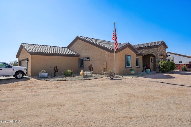 view of front of home with a garage