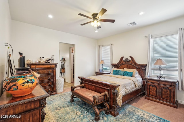 bedroom featuring ceiling fan and light colored carpet