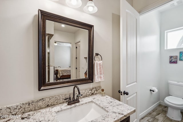 bathroom with vanity and toilet