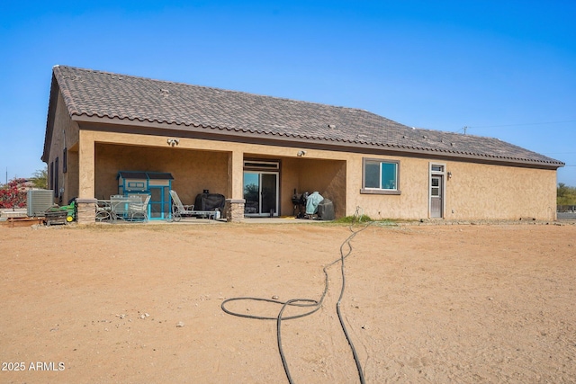 back of house with cooling unit