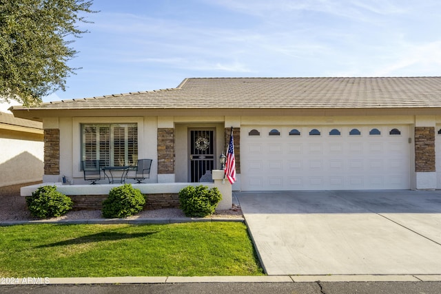 ranch-style house featuring a porch and a garage