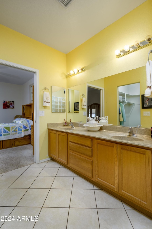 bathroom with tile patterned flooring and vanity