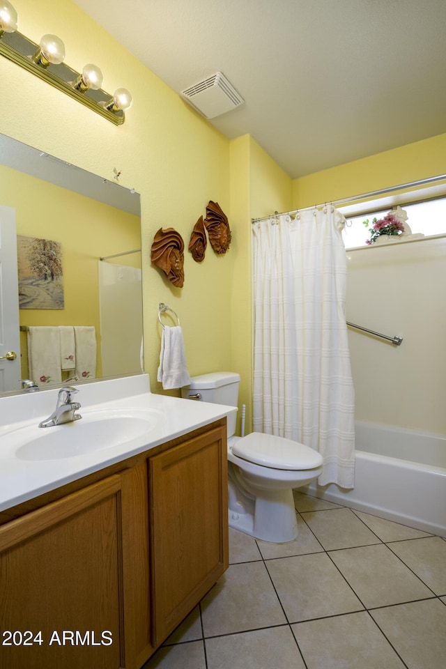 full bathroom with tile patterned floors, vanity, shower / bathtub combination with curtain, and toilet