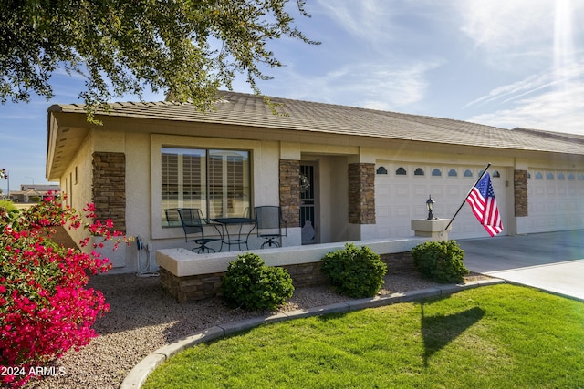 view of front of house featuring covered porch and a garage