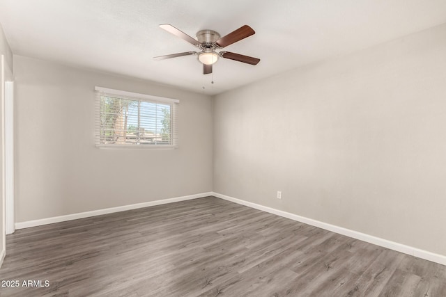 6139 N 31st Dr, Phoenix, AZ 85017 - spare room featuring baseboards, ceiling fan, and wood finished floors