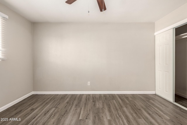6139 N 31st Dr, Phoenix, AZ 85017 - unfurnished bedroom with baseboards, a ceiling fan, a closet, and wood finished floors
