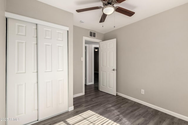 6139 N 31st Dr, Phoenix, AZ 85017 - unfurnished bedroom featuring baseboards, visible vents, and dark wood-style floors