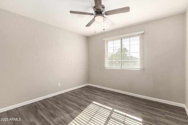 6139 N 31st Dr, Phoenix, AZ 85017 - unfurnished room with baseboards, ceiling fan, and dark wood-style floors