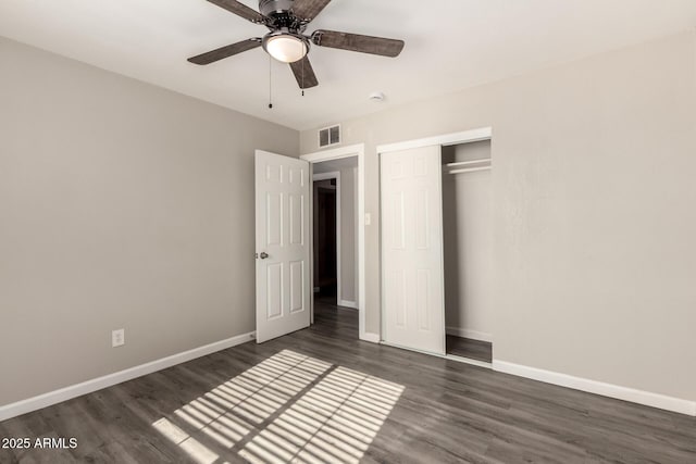 6139 N 31st Dr, Phoenix, AZ 85017 - unfurnished bedroom with visible vents, a closet, baseboards, ceiling fan, and dark wood-type flooring