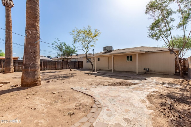 6139 N 31st Dr, Phoenix, AZ 85017 - back of house featuring a fenced backyard, a patio, and central AC