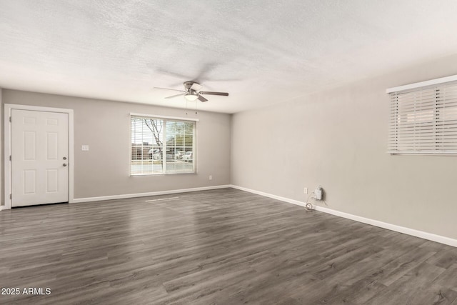 6139 N 31st Dr, Phoenix, AZ 85017 - unfurnished room with baseboards, ceiling fan, dark wood-style floors, and a textured ceiling