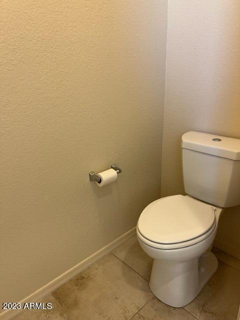 bathroom with tile patterned flooring and toilet