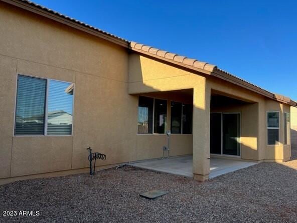 rear view of house featuring a patio