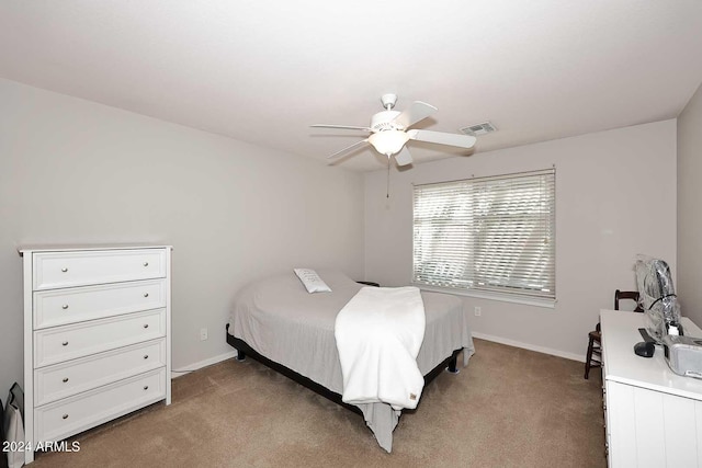 bedroom with ceiling fan and carpet flooring