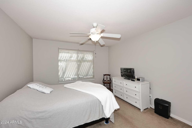 bedroom featuring ceiling fan and light carpet