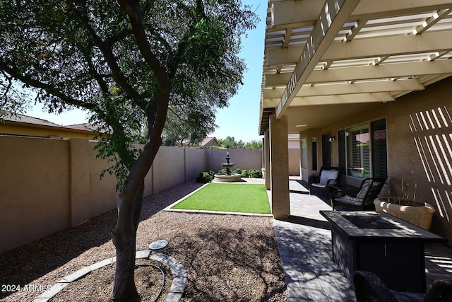 view of yard with a pergola, outdoor lounge area, and a patio area