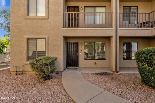 13636 N Saguaro Blvd Unit 103, Fountain Hills, AZ 85268 - view of exterior entry with stucco siding and a balcony