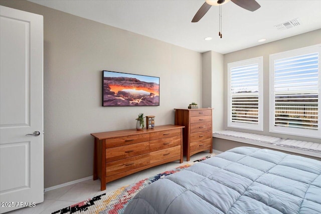 tiled bedroom with ceiling fan