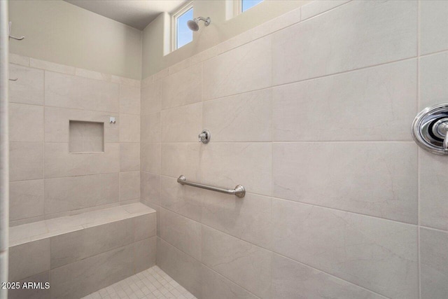 bathroom featuring a tile shower