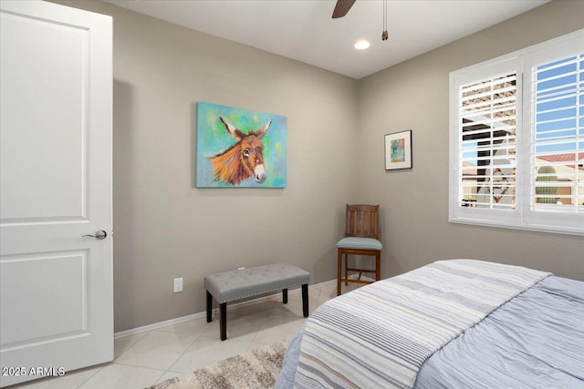 bedroom featuring light tile patterned flooring and ceiling fan