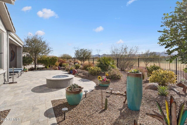 view of patio / terrace with an outdoor fire pit