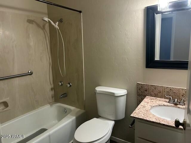 full bathroom featuring toilet, vanity, and bathtub / shower combination