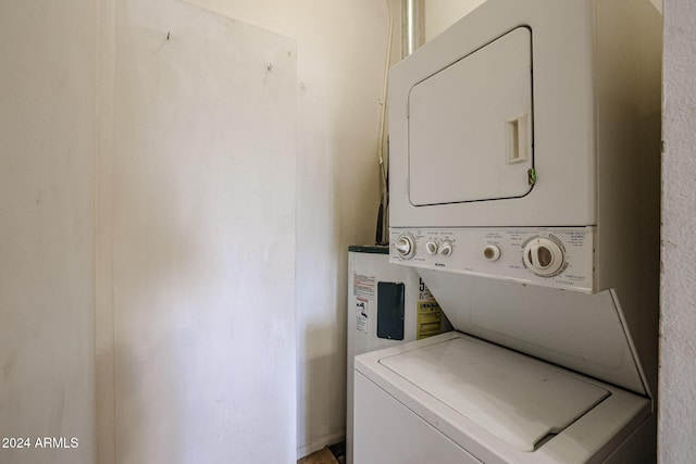 laundry area with stacked washer and clothes dryer