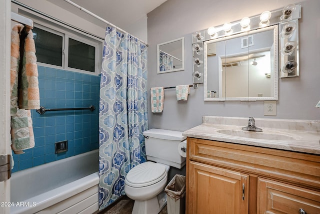 full bathroom featuring vanity, toilet, and shower / bathtub combination with curtain