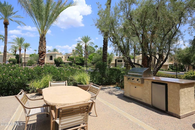 view of patio featuring an outdoor kitchen and area for grilling