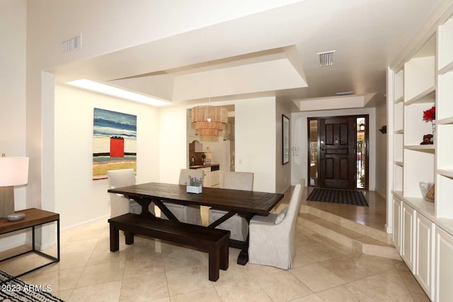 dining area featuring light tile patterned floors