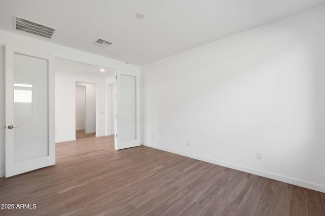 spare room featuring hardwood / wood-style floors