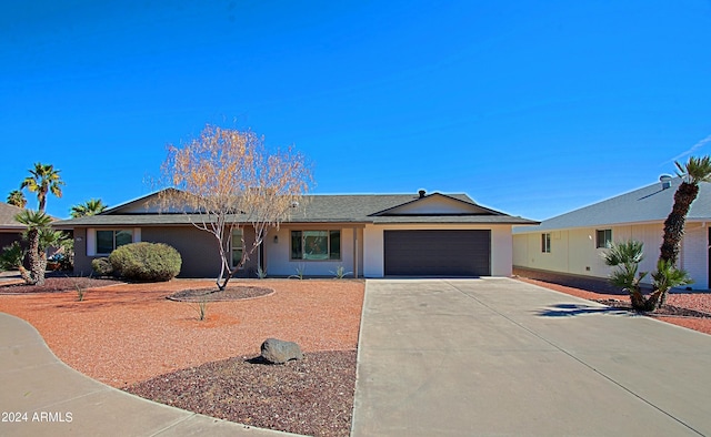 single story home featuring a garage