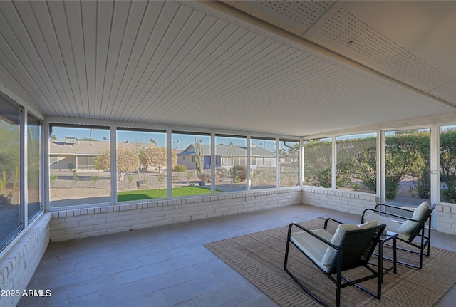 unfurnished sunroom featuring plenty of natural light