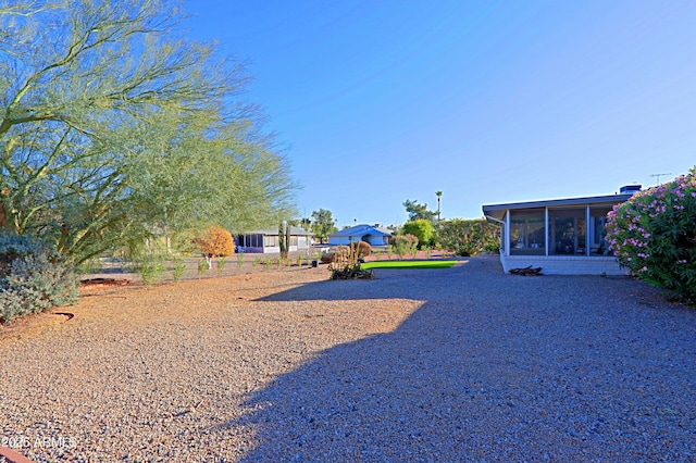 view of yard with a sunroom