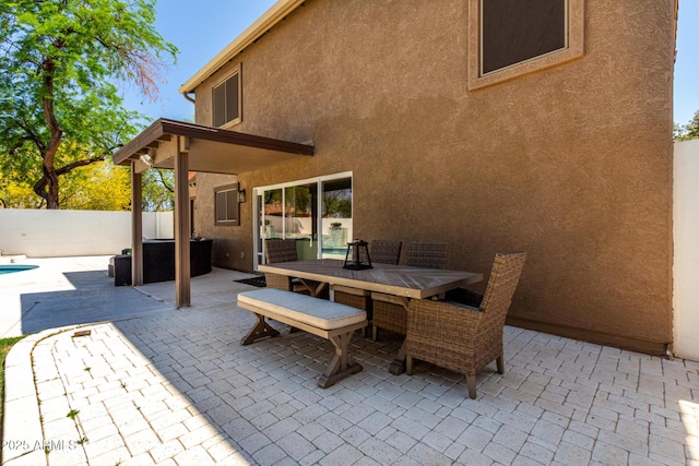 view of patio featuring outdoor dining area and fence private yard
