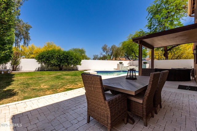 view of patio / terrace with a fenced backyard, outdoor dining area, and a fenced in pool