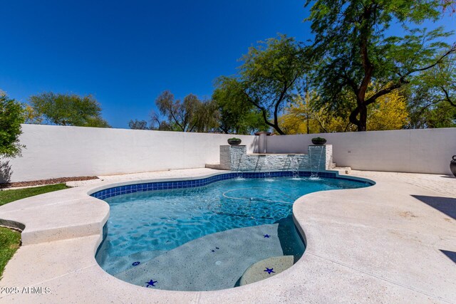 view of swimming pool featuring a fenced in pool, a patio area, and a fenced backyard