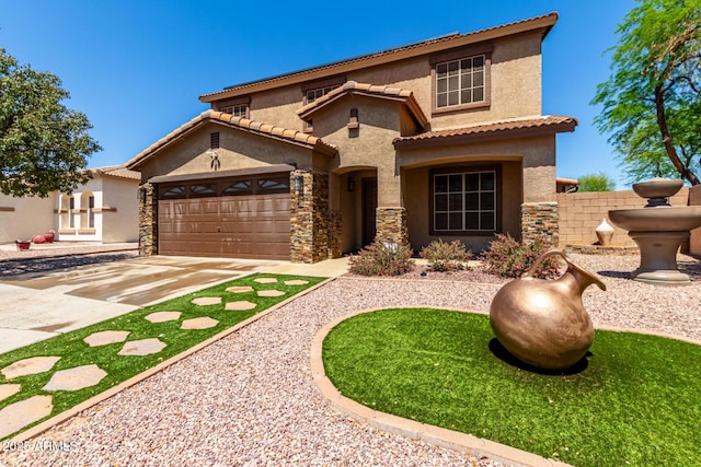 mediterranean / spanish home with a tile roof, a garage, driveway, stone siding, and stucco siding