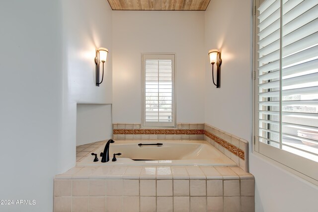 bathroom with tiled tub