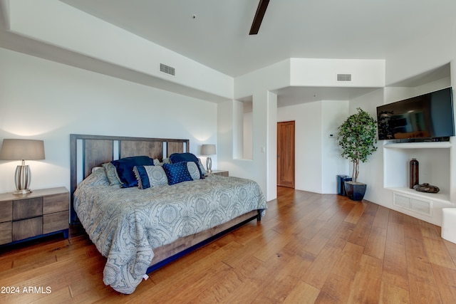 bedroom featuring ceiling fan and hardwood / wood-style floors