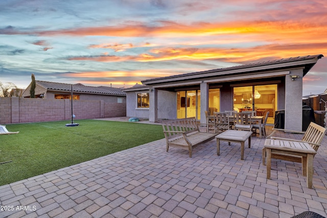 view of patio with a fenced backyard and outdoor dining space