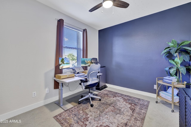 home office featuring carpet floors, baseboards, and ceiling fan