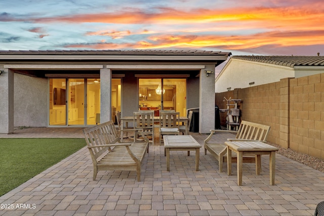 view of patio / terrace featuring fence