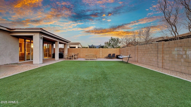 view of yard with a fenced backyard and a patio area