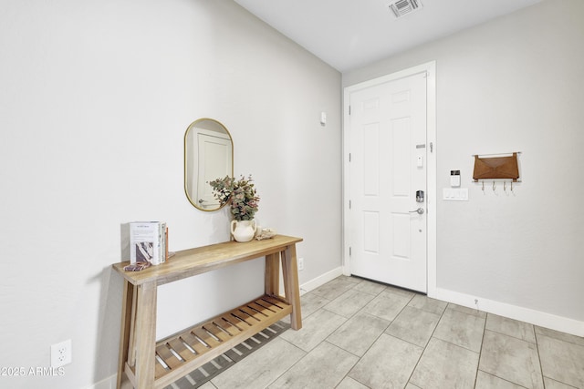 entrance foyer featuring baseboards and visible vents
