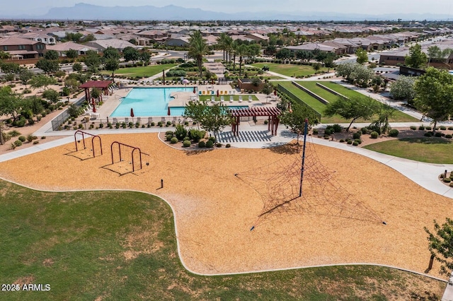 birds eye view of property with a mountain view and a residential view